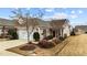 Charming one-story home with attached garage and beautifully landscaped front yard at 1404 Palmer Hill Dr, Durham, NC 27703