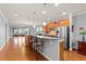 Spacious open kitchen with breakfast bar, granite countertops, and stainless steel appliances at 1404 Palmer Hill Dr, Durham, NC 27703
