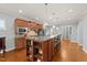 Spacious kitchen with center island, stainless steel appliances, and ample cabinet space at 1404 Palmer Hill Dr, Durham, NC 27703