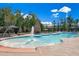 Community pool with splash pad, fireplace, umbrellas, and plentiful seating at 1404 Palmer Hill Dr, Durham, NC 27703