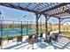 Community tennis court under a pergola and sitting area at 1404 Palmer Hill Dr, Durham, NC 27703