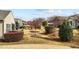 Landscaped community yard with flowering trees, bushes and maintained grass at 1404 Palmer Hill Dr, Durham, NC 27703