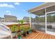 Outdoor deck featuring a grill, potted plants, and view of the screened-in porch at 1415 Dalton Pl, Mebane, NC 27302