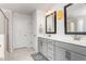 Stylish bathroom with double vanity, framed mirrors, and a walk-in shower offering a functional and elegant design at 1415 Dalton Pl, Mebane, NC 27302