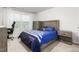 Comfortable bedroom with a bed, desk, and dresser, illuminated by natural light at 1415 Dalton Pl, Mebane, NC 27302