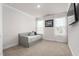 Neutral bedroom has a daybed with storage, two windows and neutral carpet at 1415 Dalton Pl, Mebane, NC 27302
