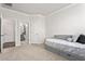 Neutral bedroom with daybed and en-suite bathroom featuring stylish decor at 1415 Dalton Pl, Mebane, NC 27302