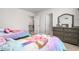 bedroom featuring coordinated unicorn themed furniture, decor, and neutral carpet at 1415 Dalton Pl, Mebane, NC 27302
