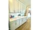 Modern gray cabinets with quartz countertops and white subway tile backsplash at 1415 Dalton Pl, Mebane, NC 27302