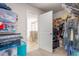 Large walk-in closet leading to an ensuite bathroom with a glass door shower at 1415 Dalton Pl, Mebane, NC 27302