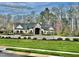 Clubhouse with stone archway entrance, sidewalks, and landscaped front yard at 1415 Dalton Pl, Mebane, NC 27302