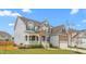Charming two-story home with a covered porch, stone accents, and well-maintained landscaping, offering great curb appeal at 1415 Dalton Pl, Mebane, NC 27302