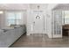 Bright foyer featuring hardwood floors, a decorative front door, and a glimpse into the living room, creating a welcoming entrance at 1415 Dalton Pl, Mebane, NC 27302