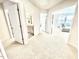 Hallway view to a bathroom and additional living room, enhancing accessibility and flow at 1415 Dalton Pl, Mebane, NC 27302