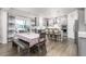 An inviting kitchen area with wood flooring and a breakfast table at 1415 Dalton Pl, Mebane, NC 27302