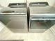 Modern grey Whirlpool washer and dryer set on tile flooring, offering convenience and style for laundry needs at 1415 Dalton Pl, Mebane, NC 27302