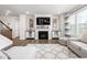 Cozy living area showcasing a fireplace with built-ins, and plush seating, creating a comfortable atmosphere at 1415 Dalton Pl, Mebane, NC 27302