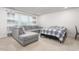 Relaxing living room with large sectional and bed setup near bright windows at 1415 Dalton Pl, Mebane, NC 27302
