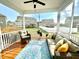 Relaxing screened porch with comfortable seating and scenic backyard views at 1415 Dalton Pl, Mebane, NC 27302
