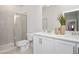 Bright bathroom boasts a double sink vanity, large mirror, and a glass-enclosed shower for a spa-like experience at 146 Weavers Grove Dr, Chapel Hill, NC 27514
