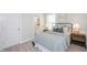 Cozy bedroom features soft carpet, a bed with stylish bedding, and a view to the ensuite bathroom at 146 Weavers Grove Dr, Chapel Hill, NC 27514