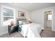 Bright bedroom featuring plush carpet, a large window, and an ensuite bathroom with modern fixtures at 146 Weavers Grove Dr, Chapel Hill, NC 27514