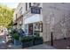 Charming Carolina Coffee Shop exterior with outdoor seating and a mural on the side of the building at 146 Weavers Grove Dr, Chapel Hill, NC 27514