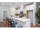 Bright kitchen with a large center island, stylish pendant lighting, stainless steel appliances, and bar stool seating at 146 Weavers Grove Dr, Chapel Hill, NC 27514