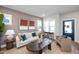 Cozy living room featuring elegant decor, including modern artwork, and a seamless transition to the entry foyer at 146 Weavers Grove Dr, Chapel Hill, NC 27514