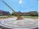 Large sundial with brick walkway, set on a lawn, with academic buildings in the background at 146 Weavers Grove Dr, Chapel Hill, NC 27514