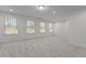 Bright and airy bedroom with plush carpeting, three large windows, and neutral decor at 150 Alamosa Pl, Cary, NC 27519
