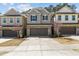 Charming townhome with a brick-accented facade and a well-maintained front yard in a desirable neighborhood at 150 Alamosa Pl, Cary, NC 27519