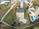 An aerial of a neighborhood with a pool, trampoline, a playset, and manicured lawns at 1527 Ingraham Dr, Apex, NC 27502