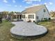 Aerial view of the backyard featuring a large patio, playset, and lush greenery at 1527 Ingraham Dr, Apex, NC 27502