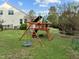 Spacious backyard featuring a wooden playset, perfect for outdoor fun and relaxation at 1527 Ingraham Dr, Apex, NC 27502