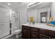 Bathroom features a glass shower, single vanity, and a large mirror at 1527 Ingraham Dr, Apex, NC 27502