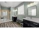 Bathroom features a double vanity, large mirror, and a glass shower at 1527 Ingraham Dr, Apex, NC 27502