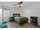 Cozy bedroom boasts a ceiling fan and reading nook by the window at 1527 Ingraham Dr, Apex, NC 27502