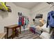 Spacious walk-in closet with shelving, hanging racks, and a wooden desk at 1527 Ingraham Dr, Apex, NC 27502