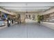 Spacious two car garage with epoxy floor and wall mounted storage and bike racks at 1527 Ingraham Dr, Apex, NC 27502