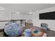 Living room area features an entertainment center and railing at 1527 Ingraham Dr, Apex, NC 27502