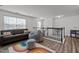 Upstairs living room area features a couch, beanbag chair, and railing at 1527 Ingraham Dr, Apex, NC 27502