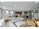 Open-concept living area with a modern kitchen, dining space, and living room at 1527 Ingraham Dr, Apex, NC 27502