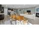Open-concept living space with kitchen, dining area, and living room with fireplace at 1527 Ingraham Dr, Apex, NC 27502