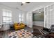 Bright and airy office featuring a colorful rug, french doors, and a large window at 1527 Ingraham Dr, Apex, NC 27502