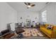 Bright playroom with a ceiling fan, colorful rug, and storage at 1527 Ingraham Dr, Apex, NC 27502