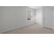 A well lit bedroom with a window and a door to a closet at 200 Olive Branch St, Sanford, NC 27332