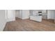 Spacious kitchen with white cabinets, stainless steel appliances, and views into the living room at 200 Olive Branch St, Sanford, NC 27332