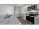 Modern kitchen featuring granite countertops, stainless steel appliances, and ample cabinet space at 200 Olive Branch St, Sanford, NC 27332