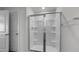 A shower with glass doors and shelves at 200 Olive Branch St, Sanford, NC 27332